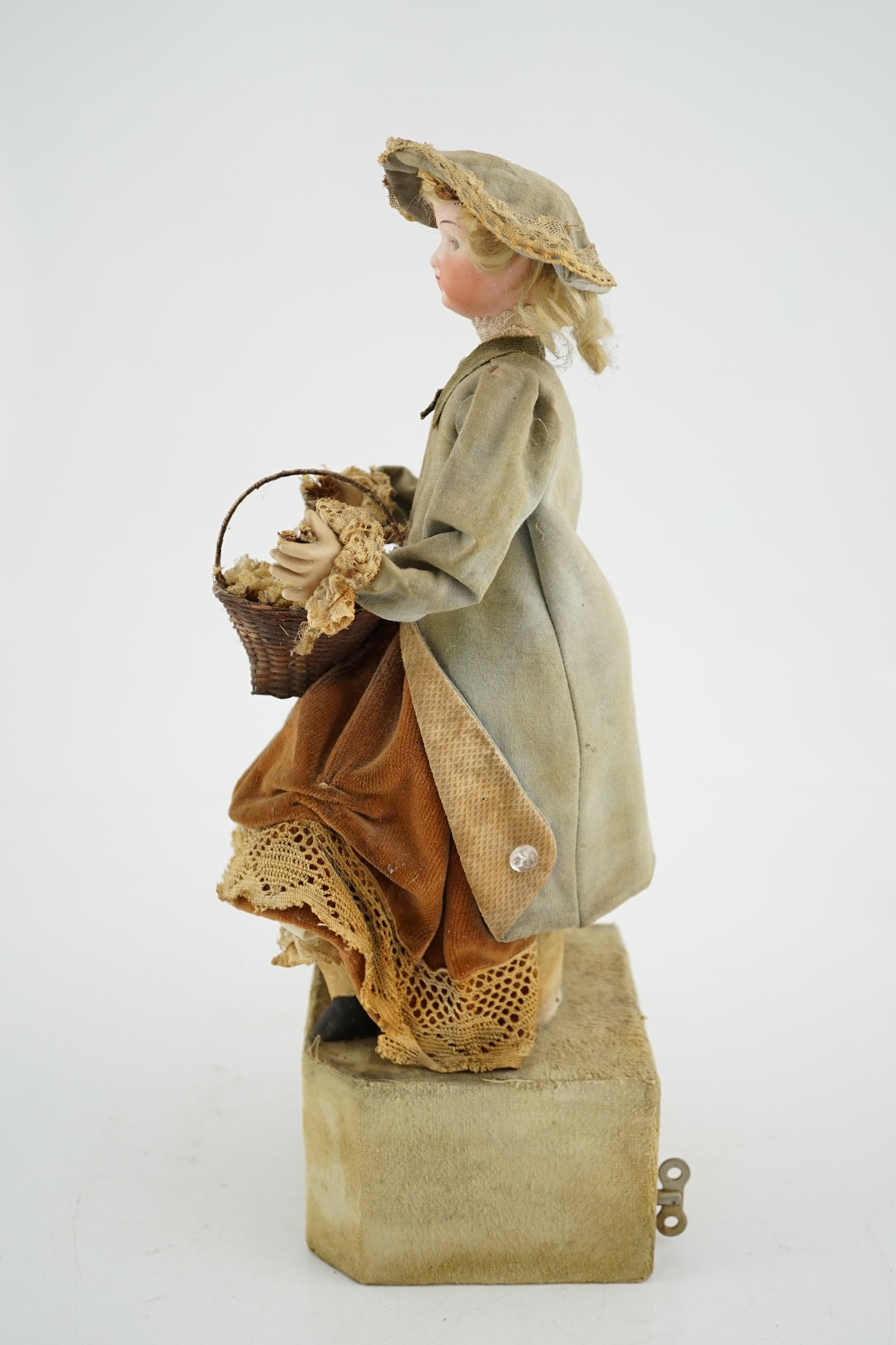 A German automaton of a flower seller, 39cm high